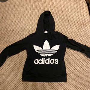 Black Adidas hoodie, tag says brand is Adidas.